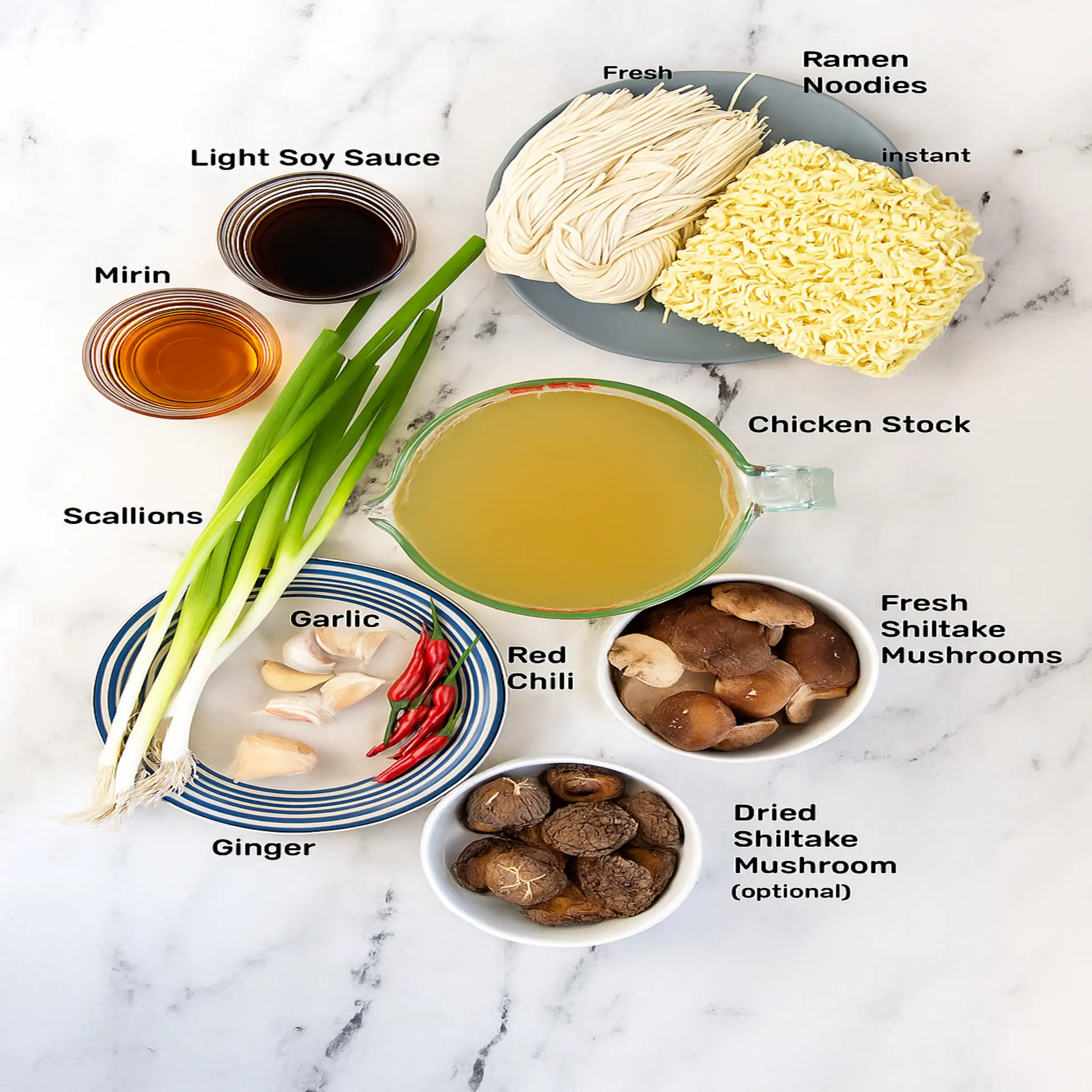 Ginger Glazed Chicken Ramen Flat lay of raw ingredients for Ginger Glazed Chicken Ramen on wooden surface.