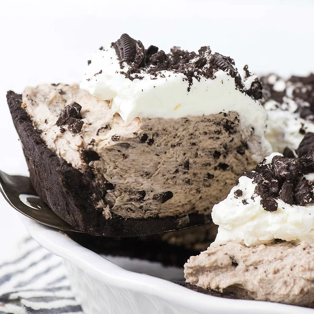 Oreo pudding pie Oreo Pudding Pie, topped with whipped cream and crushed Oreos, ready to serve