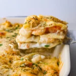 creamy seafood lasagna slice with shrimp, scallops, and cheese